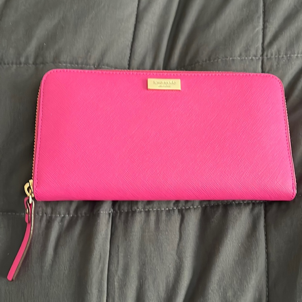 NWOT Kate Spade PINK wallet. Comes with care card.